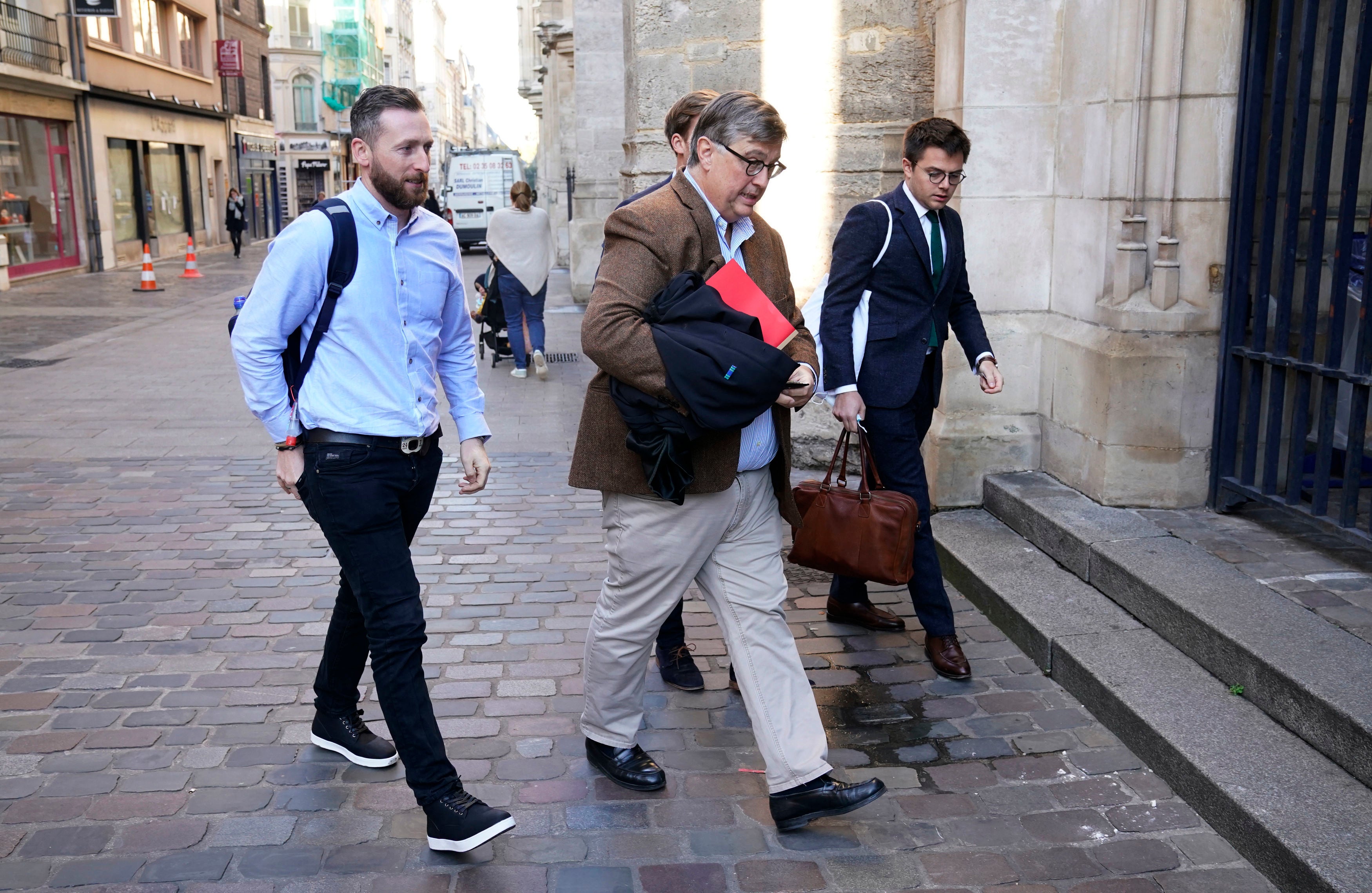 Jondy Ward (left), the skipper of a Scottish-registered scallop dredger being held in Le Havre, arrives at the Court of Appeal in Rouen on Wednesday