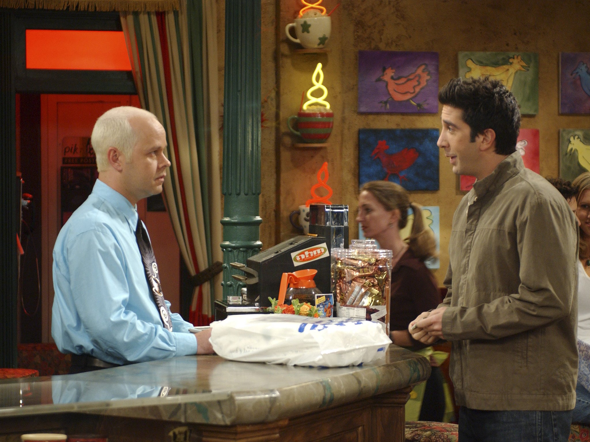 Tyler as Gunther in a scene with David Schwimmer, who played Ross Geller