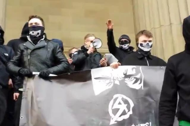 <p>Ben Raymond, centre, speaking at a National Action demonstration in Liverpool in February 2016</p>