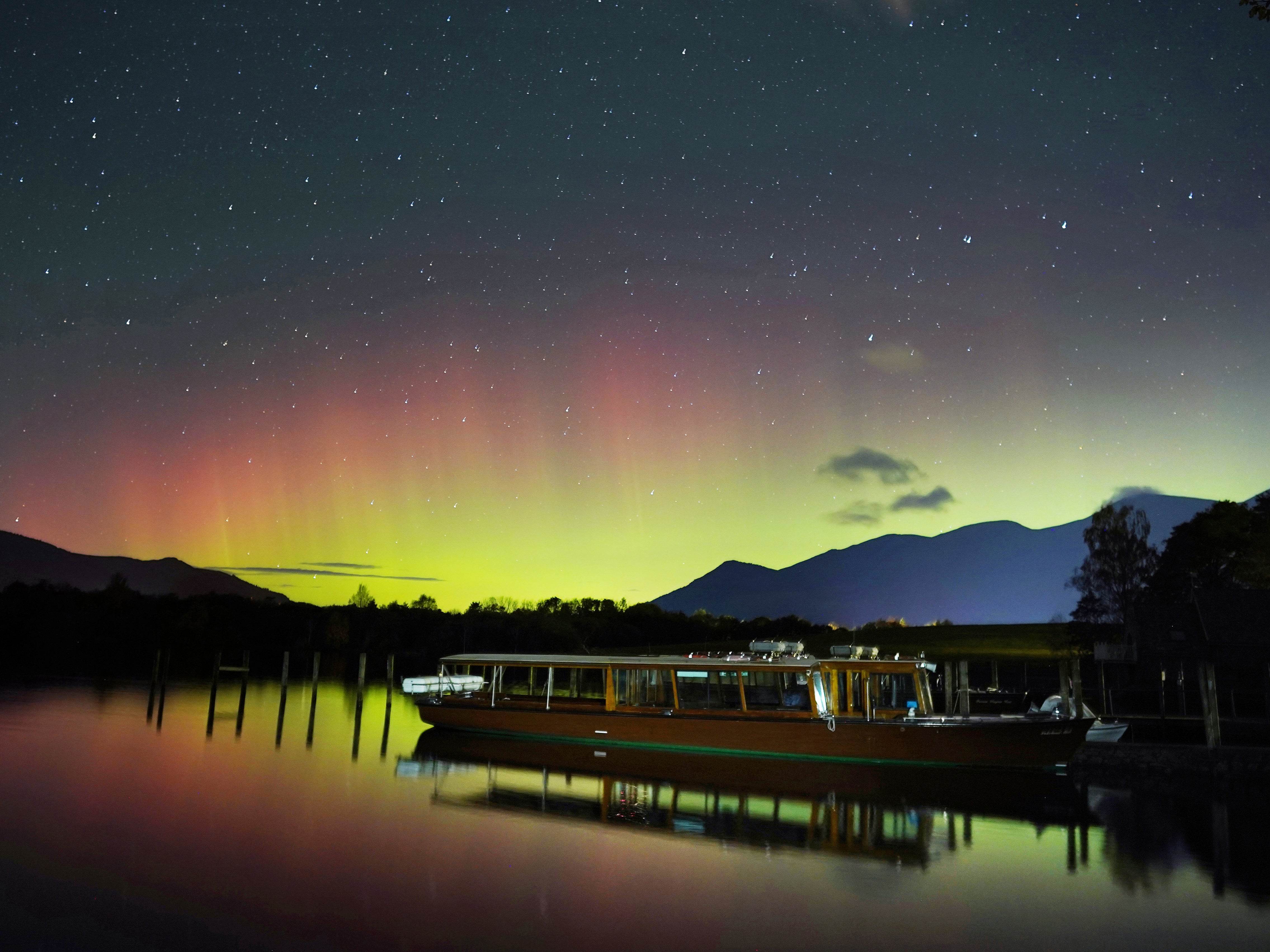 <p>A spectacular display of the Northern Lights seen over Derwentwater near Keswick in the Lake District in early hhours of 4 November 2021</p>