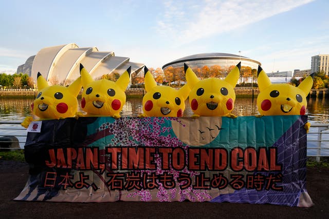 <p>Activists dressed as Pikachu took to Glasgow on Thursday to protest against coal use in Japan </p>