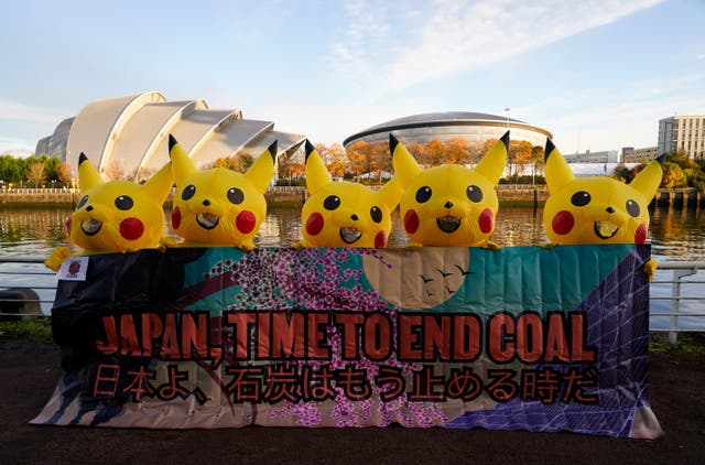 <p>Activists dressed as Pikachu took to Glasgow on Thursday to protest against coal use in Japan </p>