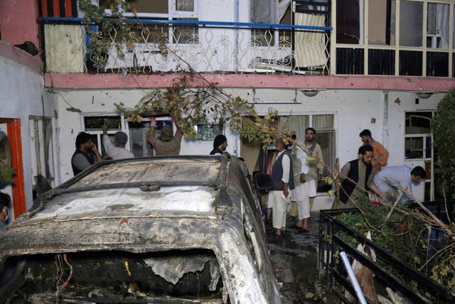 <p>Afghans inspect damage of Ahmadi family house after U.S. drone strike on Aug. 29, 2021, in Kabul, Afghanistan</p>