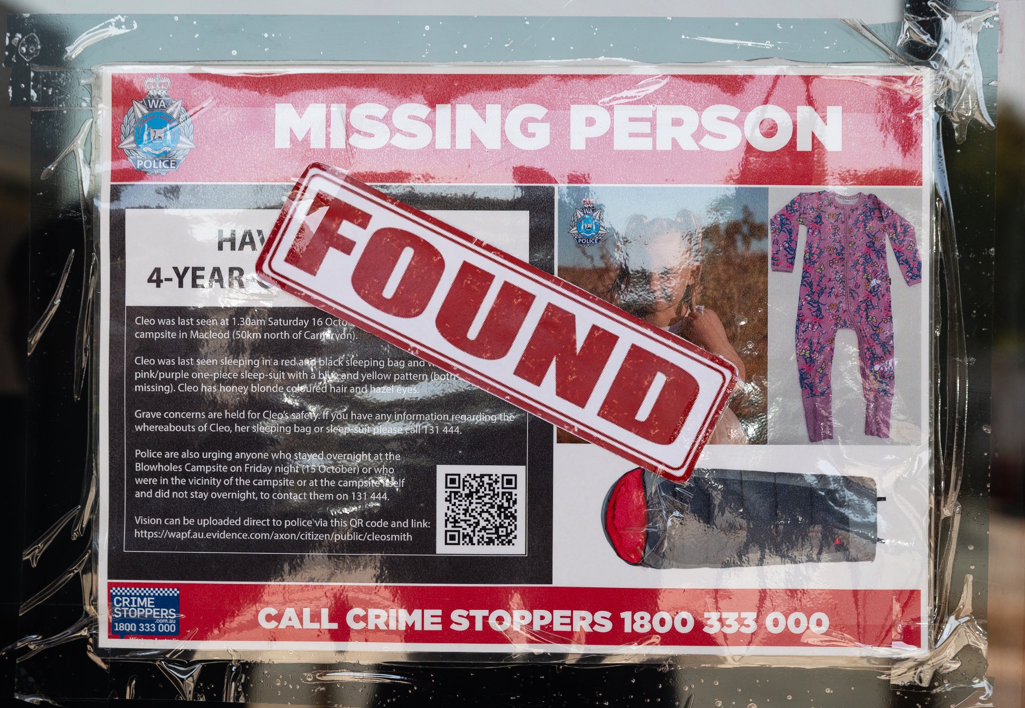 A Missing Person poster for Cleo Smith outside the police station in Carnarvon, Australia has had a ‘FOUND’ sticker placed over it