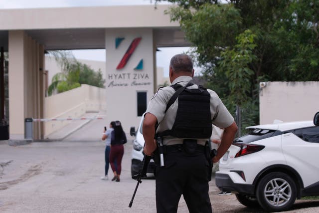 <p>Government forces guard the entrance of hotel after an armed confrontation near Puerto Morelos, Mexico, on Thursday 4 November </p>