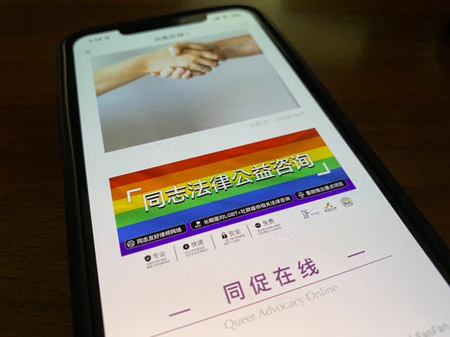 <p>An online post about the work of the group with a link to their social media account is displayed on a phone in Beijing on Friday </p>