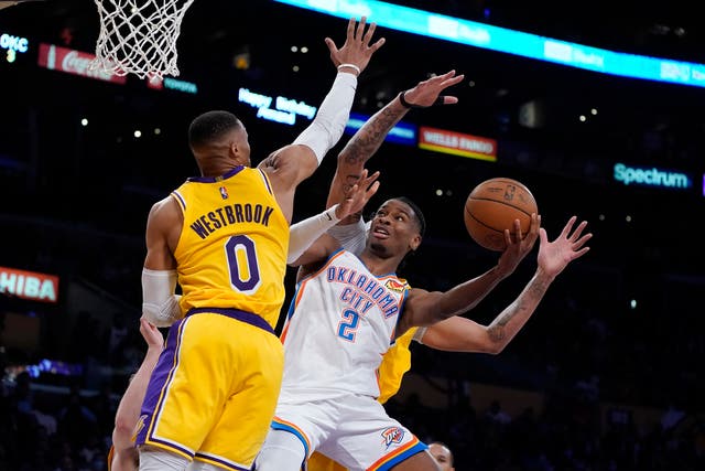 Oklahoma City Thunder guard Shai Gilgeous-Alexander (2) shoots over Los Angeles Lakers guard Russell Westbrook (0) (Marcio Jose Sanchez/AP)
