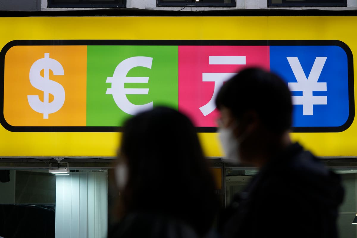 Asian shares mostly lower after fresh Wall St records