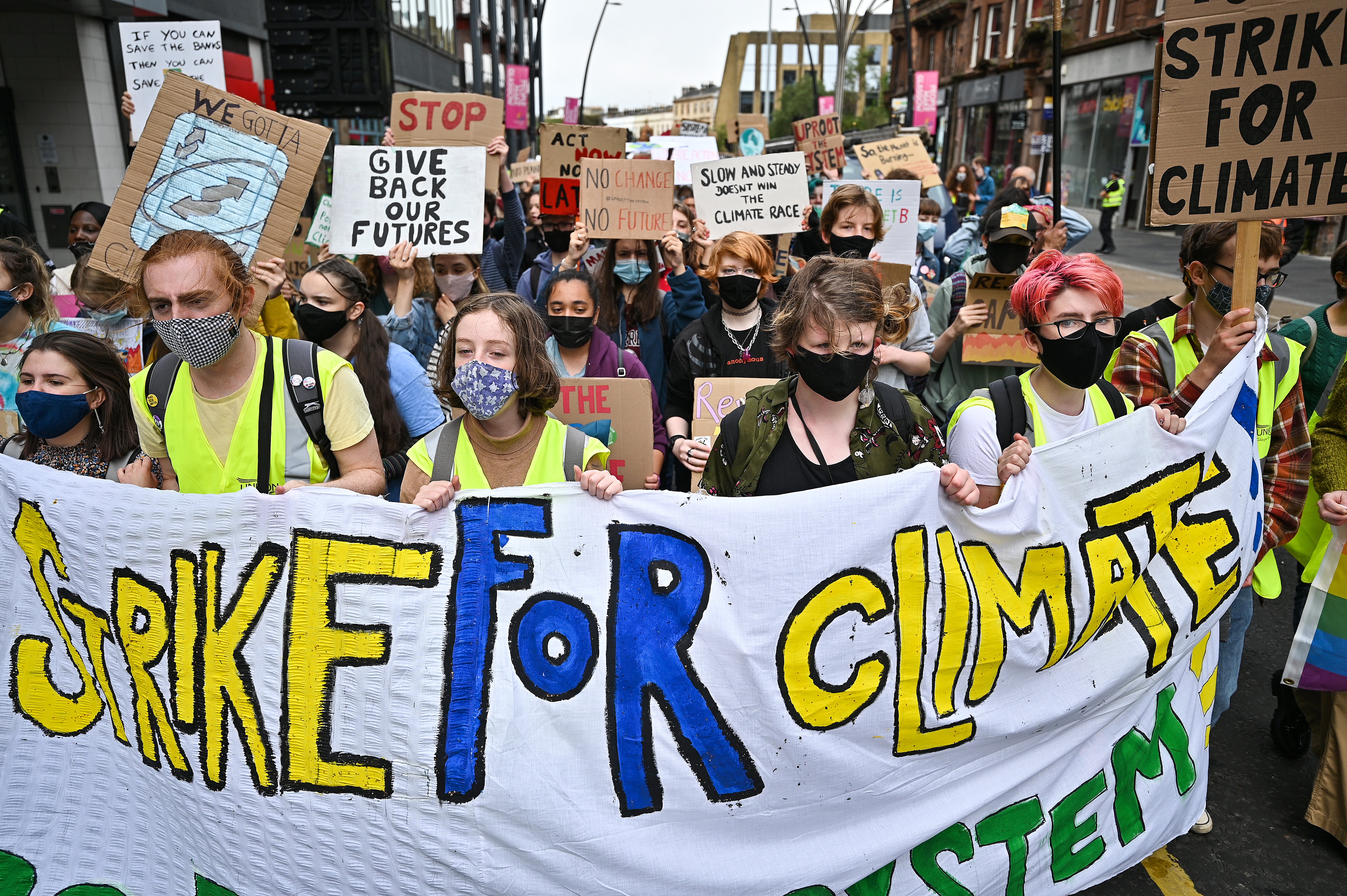 <p>School children take part in a climate strike popularised by Swedish activist Greta Thunberg on September 24, 2021 in Glasgow, Scotland. </p>