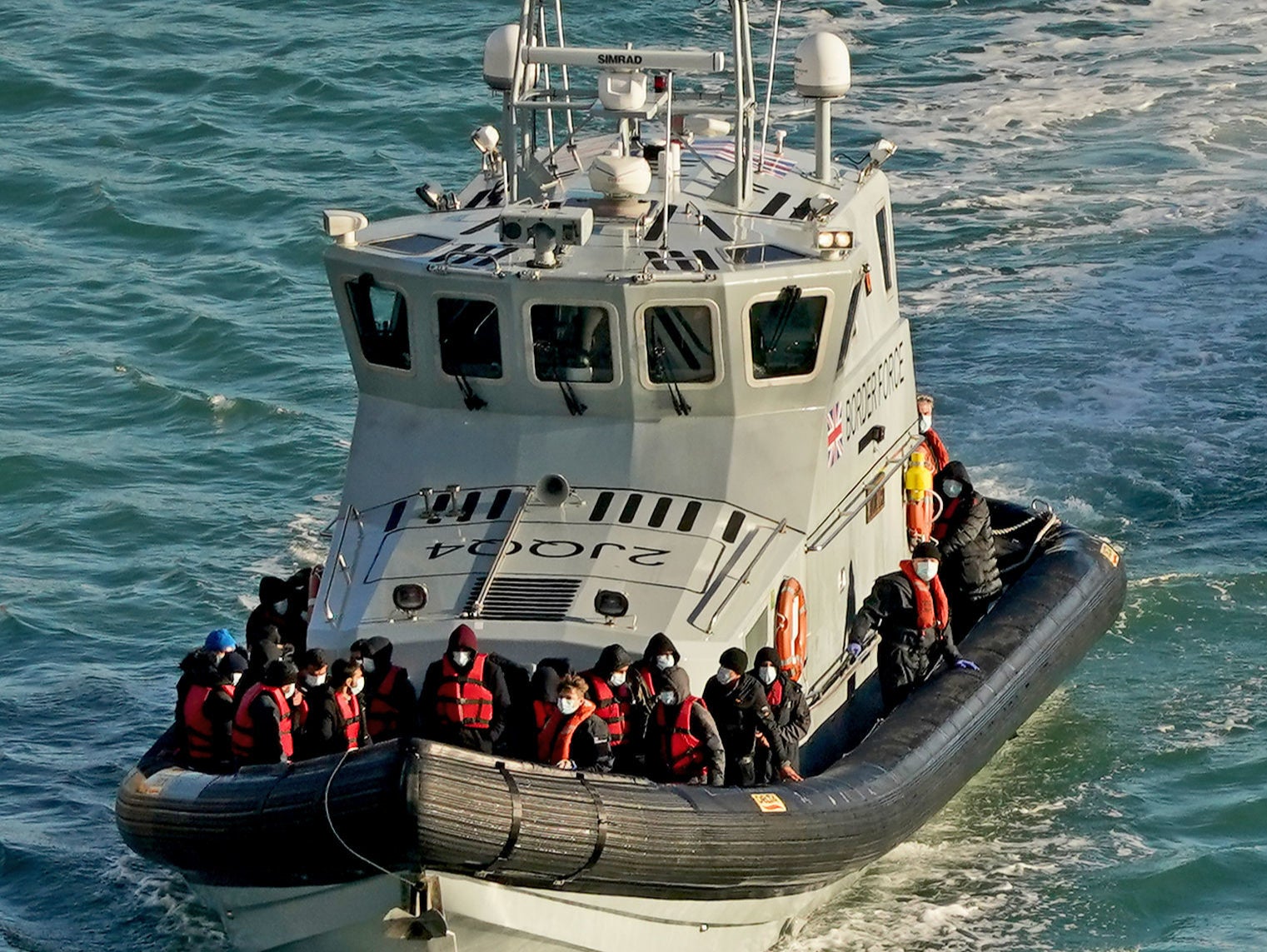 A group of people thought to be migrants are brought to Dover in November