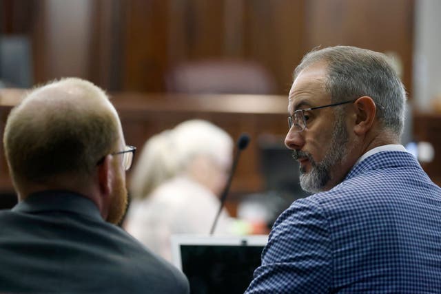 <p>Defense attorney Jason Sheffield, right, made his closing argument on Monday at the trial of Travis McMichael, left </p>