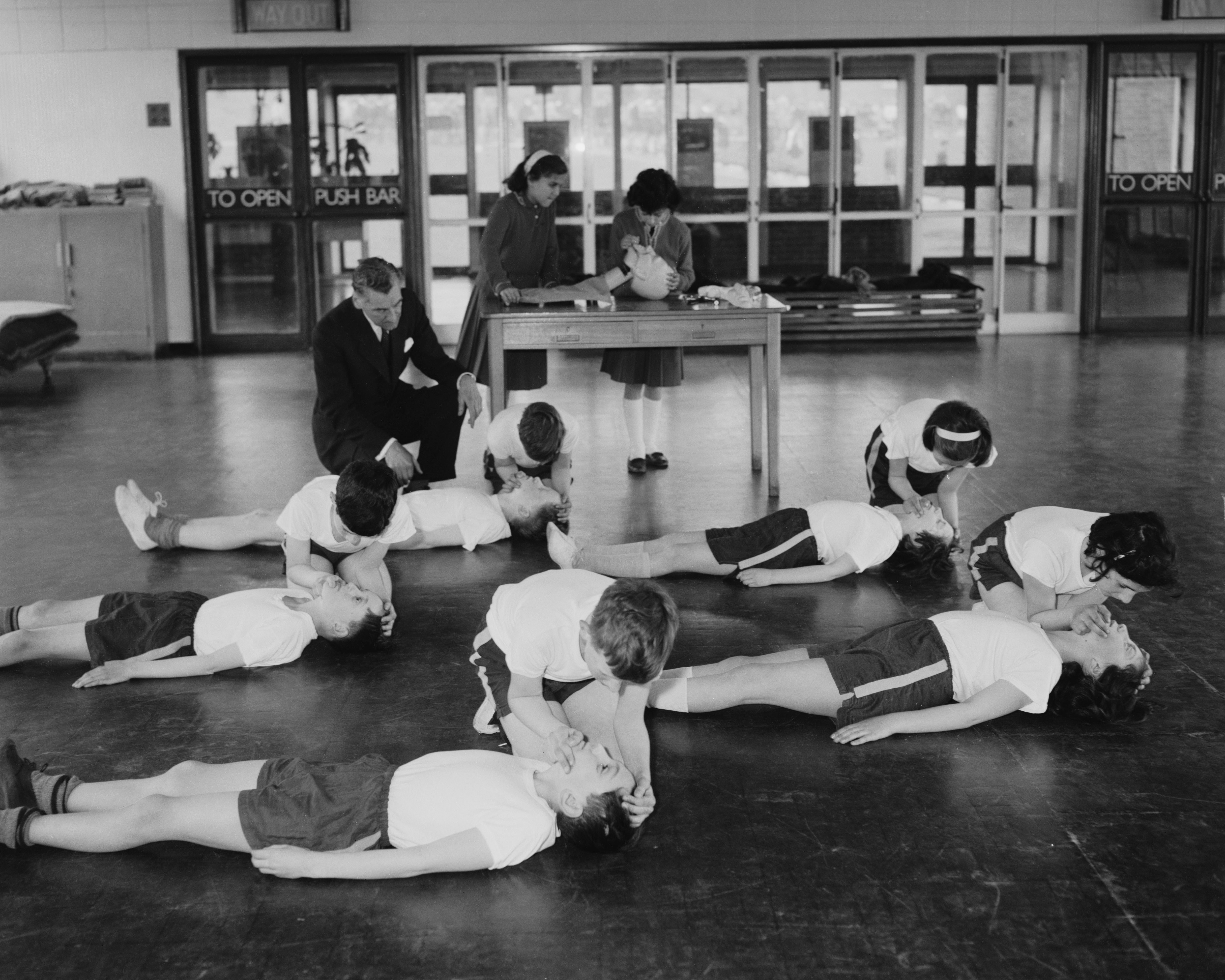 Pupils at the Mount Stewart Junior School in Kenton, Middlesex, use a dummy to practise CPR in 1963