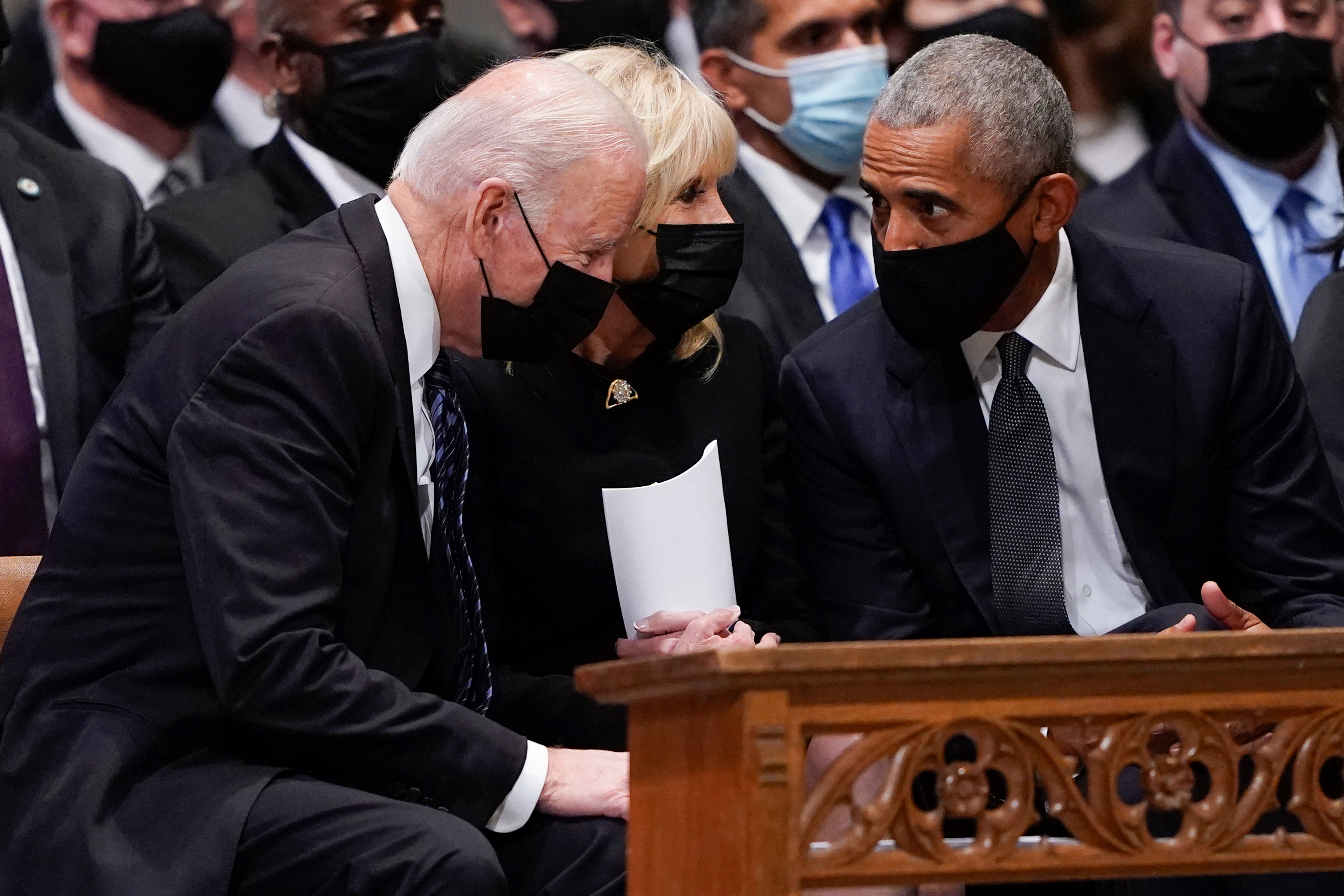President Joe Biden and first lady Jill Biden talk with former President Barack Obama before the funeral for former Secretary of State Colin Powell at the Washington National Cathedral on 5 November, 2021.