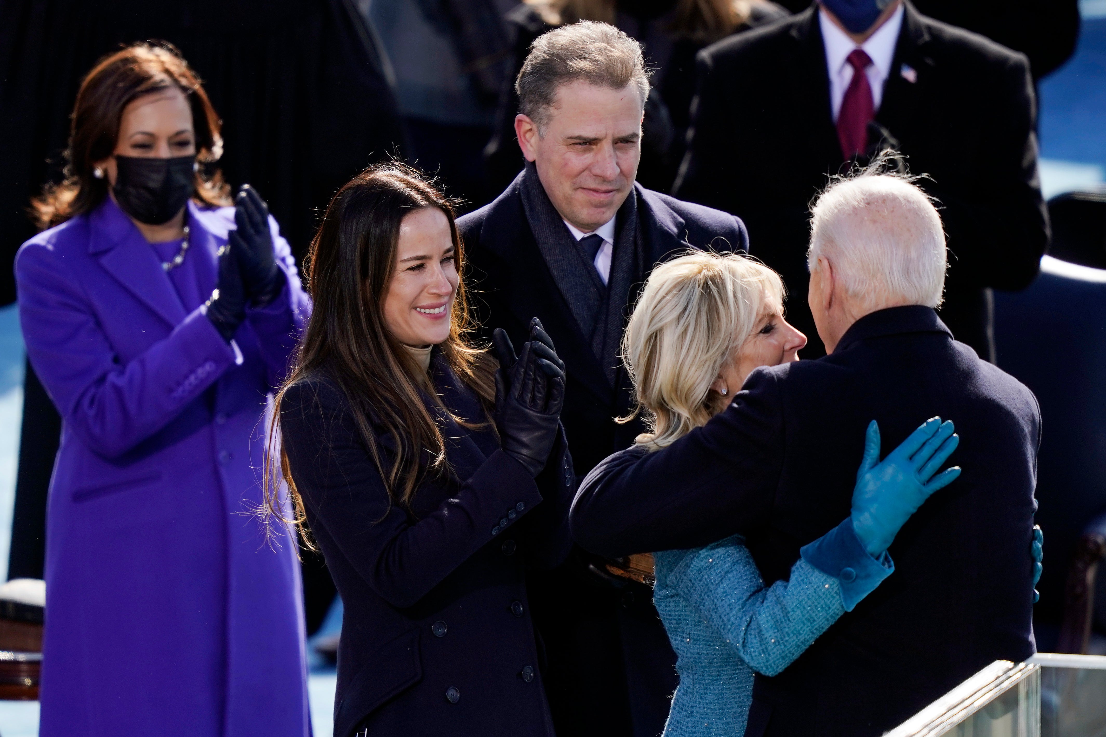 Ashley Biden and Hunter Biden look on as Joe Biden embraces his wife Jill Biden during his presidential inauguration