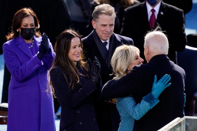 <p>Ashley Biden and Hunter Biden look on as Joe Biden embraces his wife Jill Biden during his presidential inauguration</p>