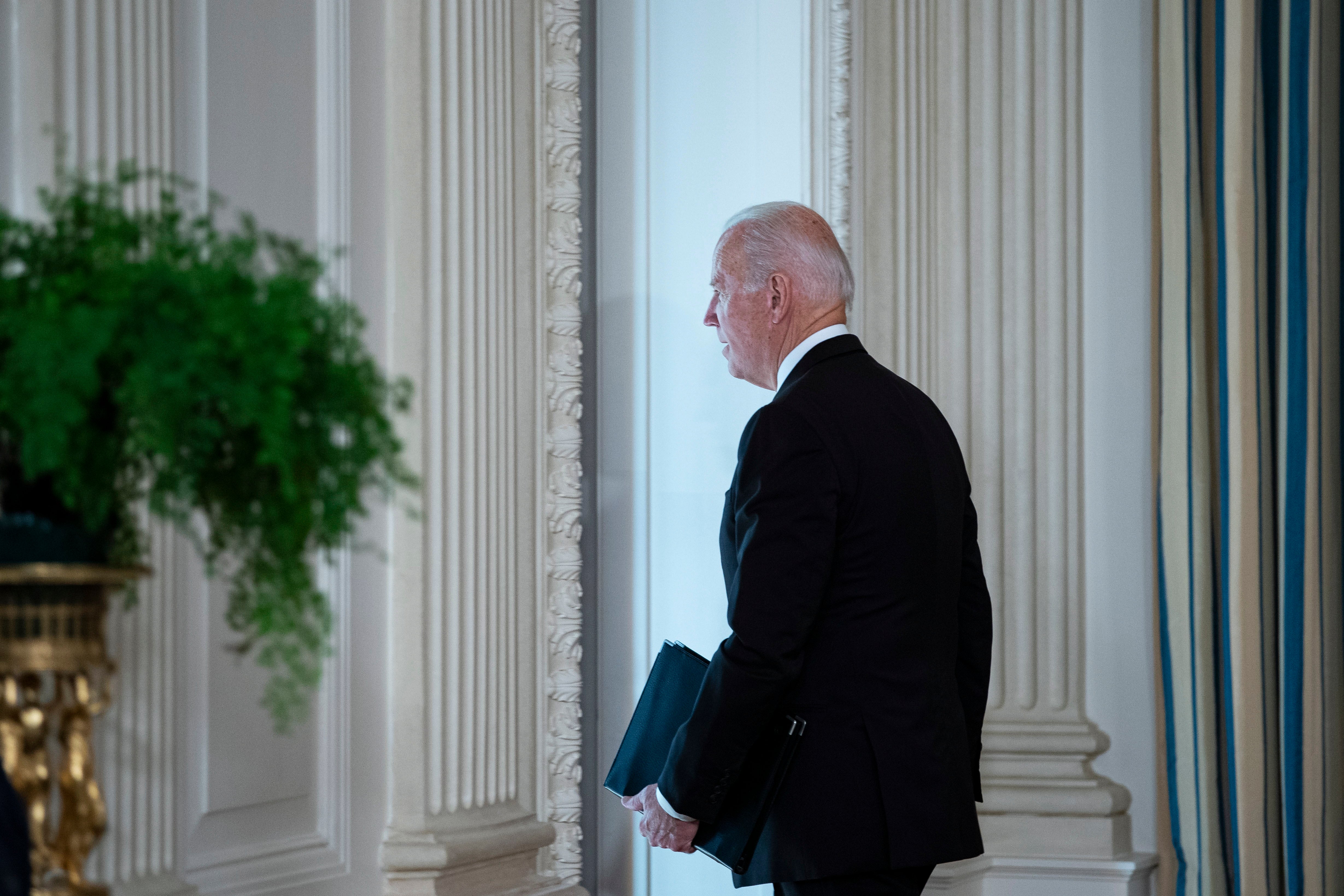 President Joe Biden leaves after speaking on the October jobs report in the State Dining of the White House in Washington, DC, USA, on 05 November 2021