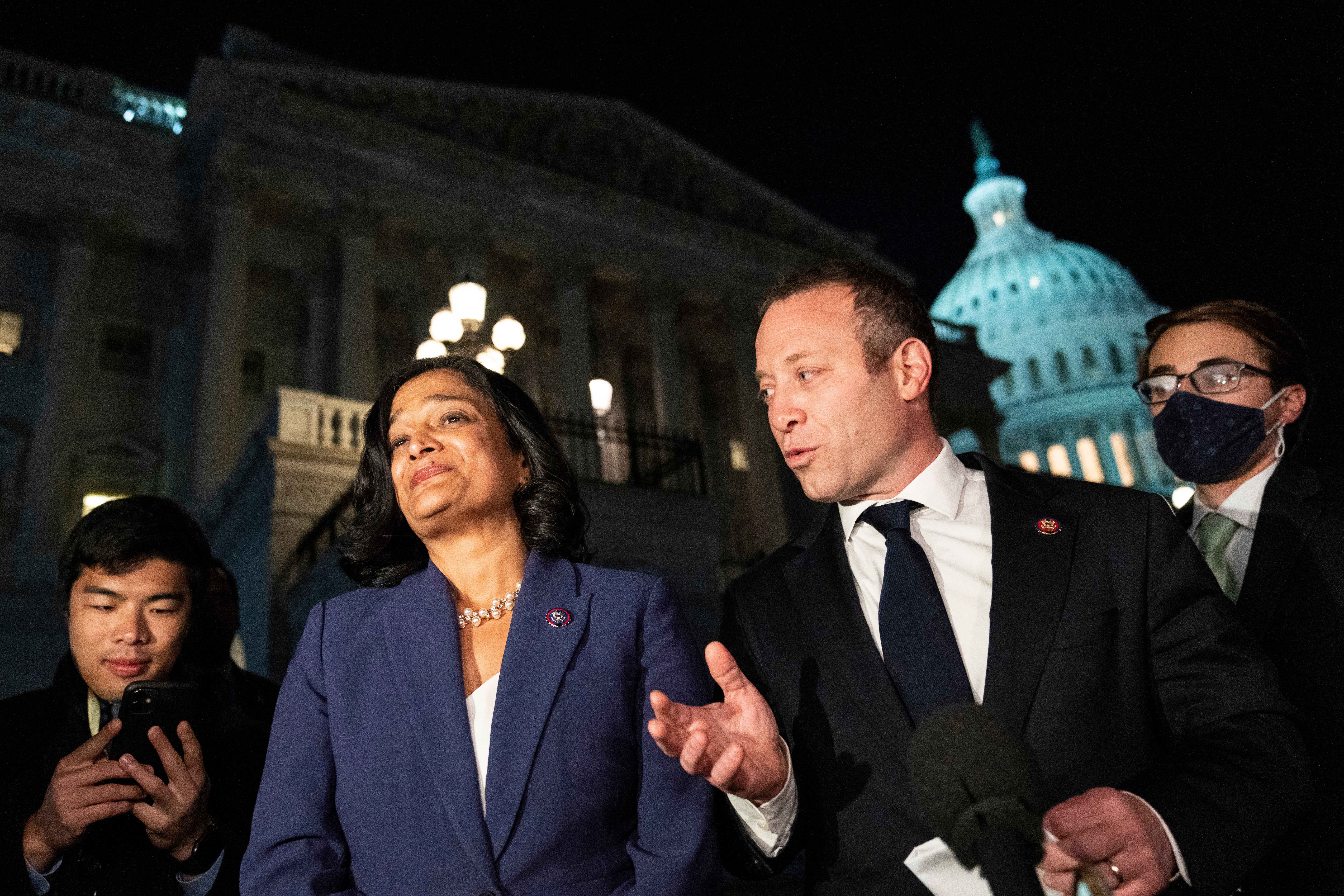 Rep Pramila Jayapal (D-WA) and Rep Josh Gottheimer (D-NJ) speak to reporters outside the US Capitol to announce a deal between Progressive House Democrats and Moderate House Democrats