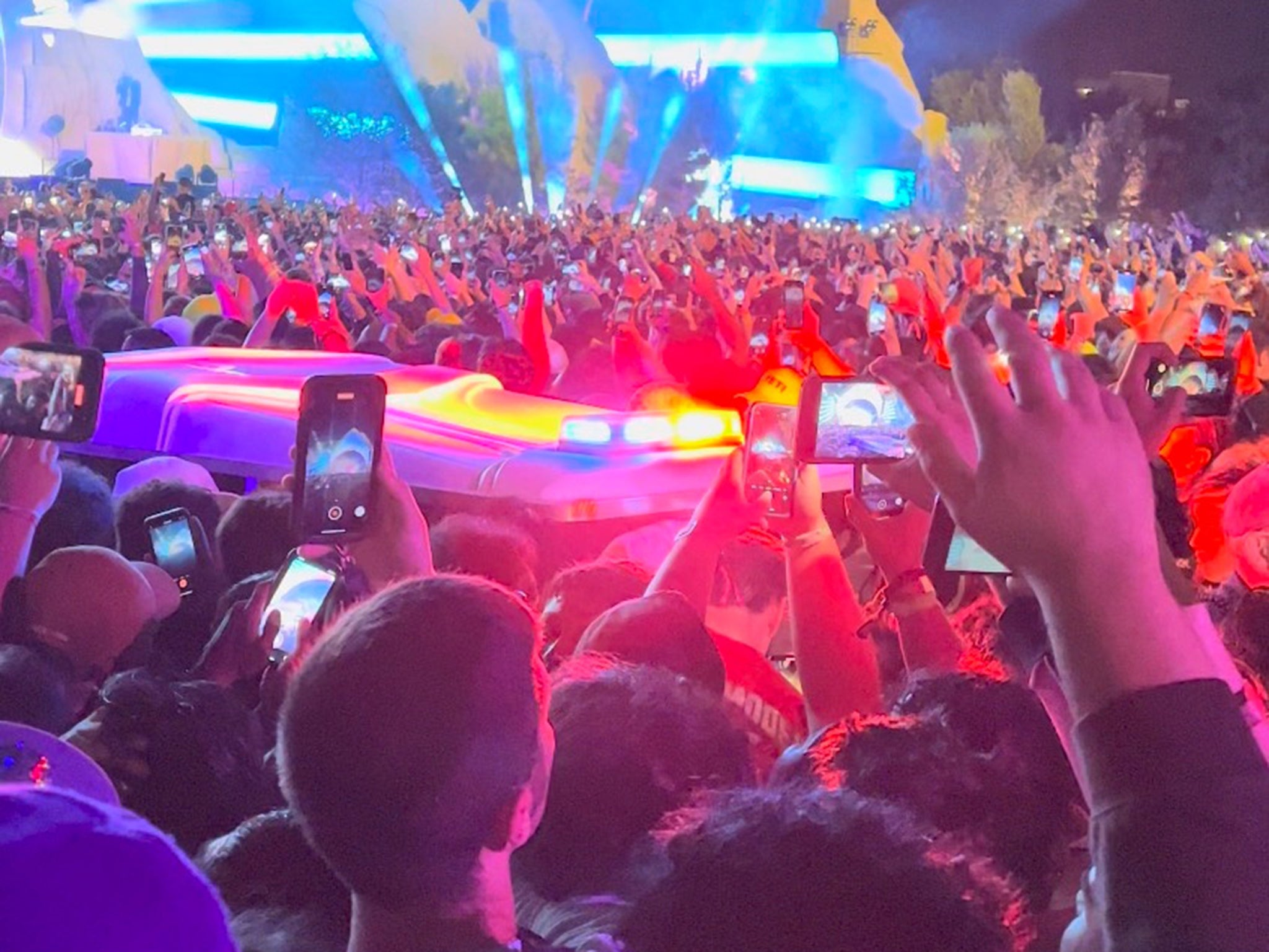 An ambulance is seen making its way through the crowd at Astroworld