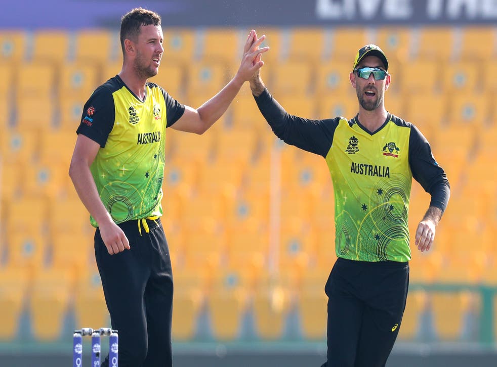 Josh Hazlewood (left) and Glenn Maxwell (right) celebrate the wicket of Shimron Hetmyer during their eight-wicket win over the West Indies at the T20 World Cup (Kamran Jebreili/AP)