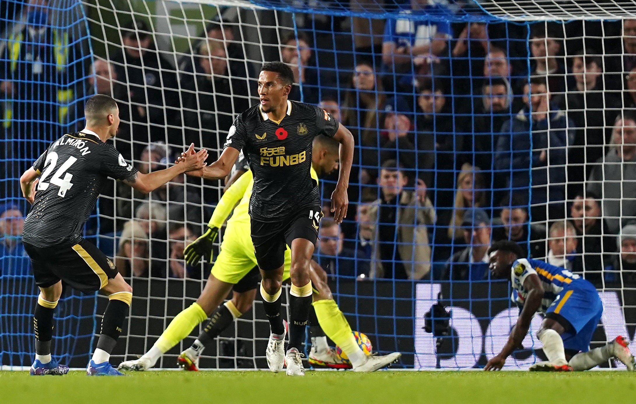 Newcastle’s Isaac Hayden (centre) celebrates his side’s equaliser in a 1-1 draw at Brighton (Gareth Fuller/PA Images).
