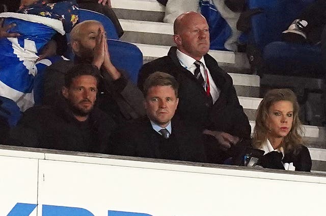 <p>Eddie Howe (centre), Newcastle owner Amanda Staveley (right) and Jason Tindall in the stands during Newcastle’s 1-1 draw at Brighton</p>