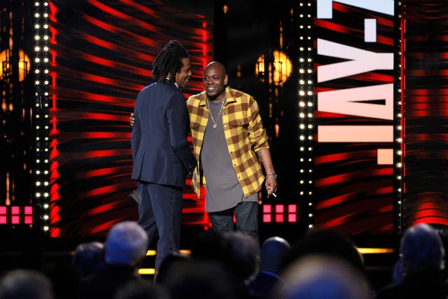 <p>File: Dave Chappelle inducts Jay-Z onstage during the 36th Annual Rock and Roll Hall Of Fame induction ceremony at Rocket Mortgage Fieldhouse on 30 October 2021 in Cleveland, Ohio</p>