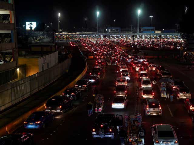 <p>Cars wait for the US-Mexico border to reopen in Tijuana, Mexico</p>