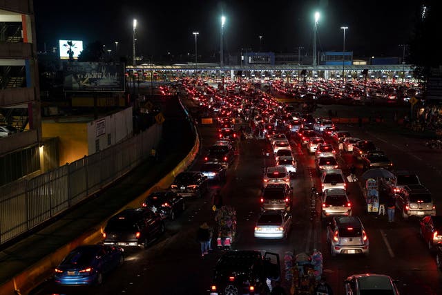 <p>Cars wait for the US-Mexico border to reopen in Tijuana, Mexico</p>