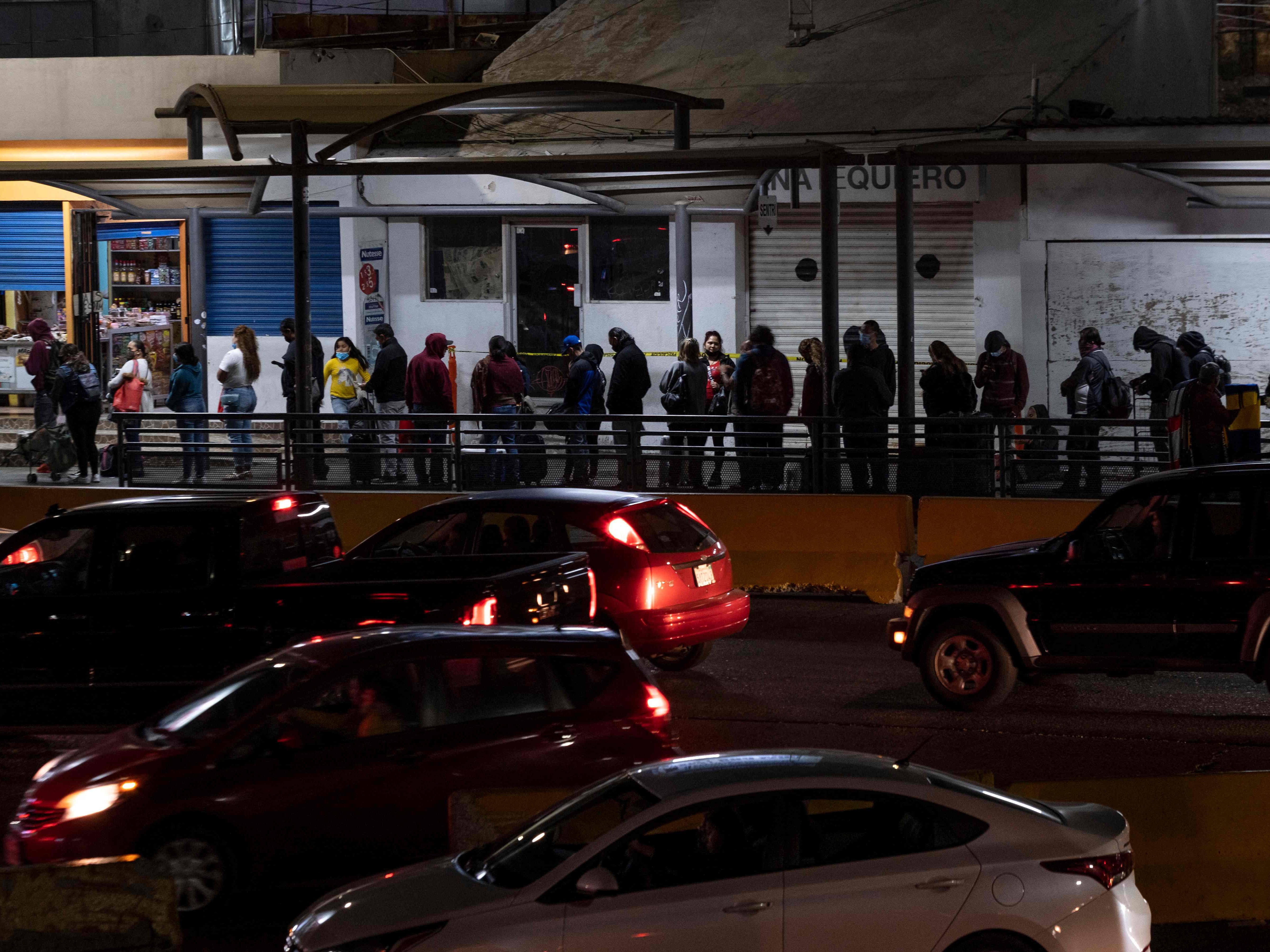Pedestrians waiting to enter the US from Tijuana, Mexico