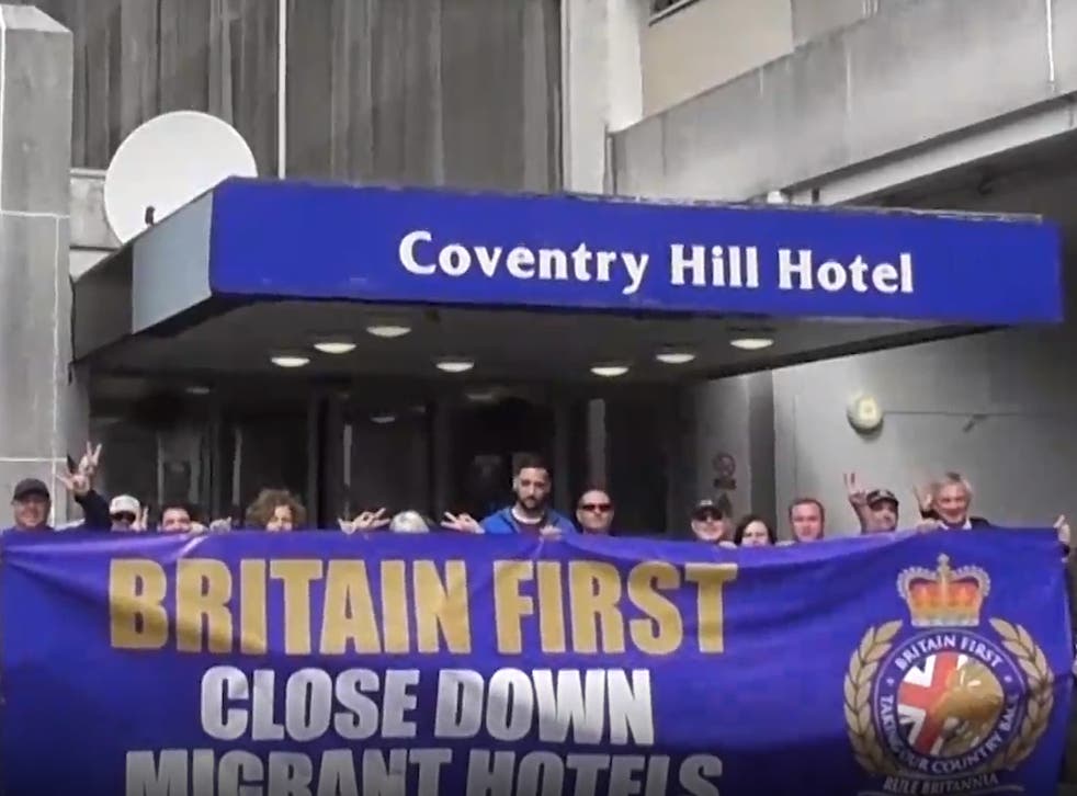 <p>James White, centre in blue hooded top, seen with other Britain First activists at a protest at the Coventry Hill Hotel in August 2020</p>