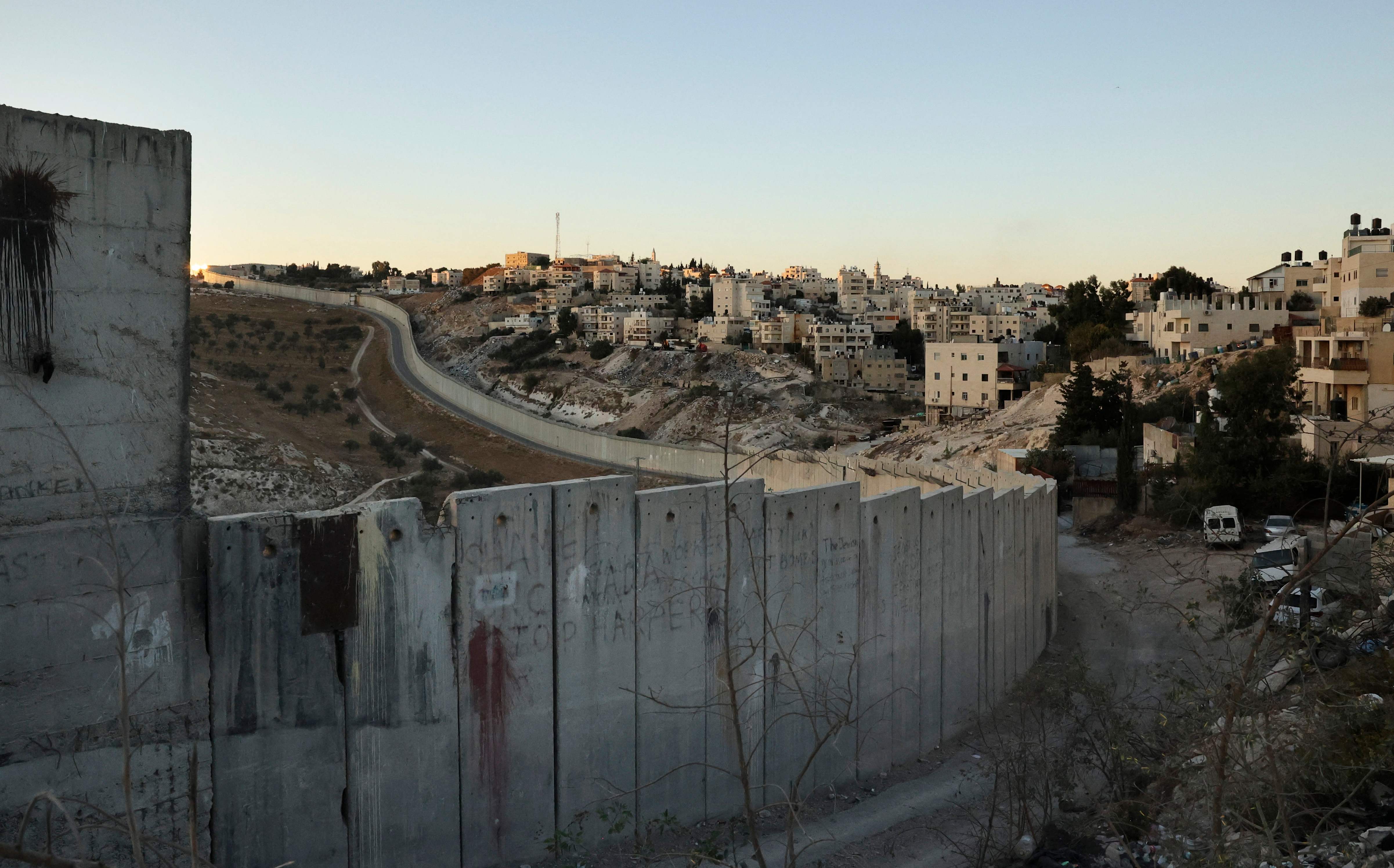 <p>Israel's separation barrier cutting through the West Bank</p>