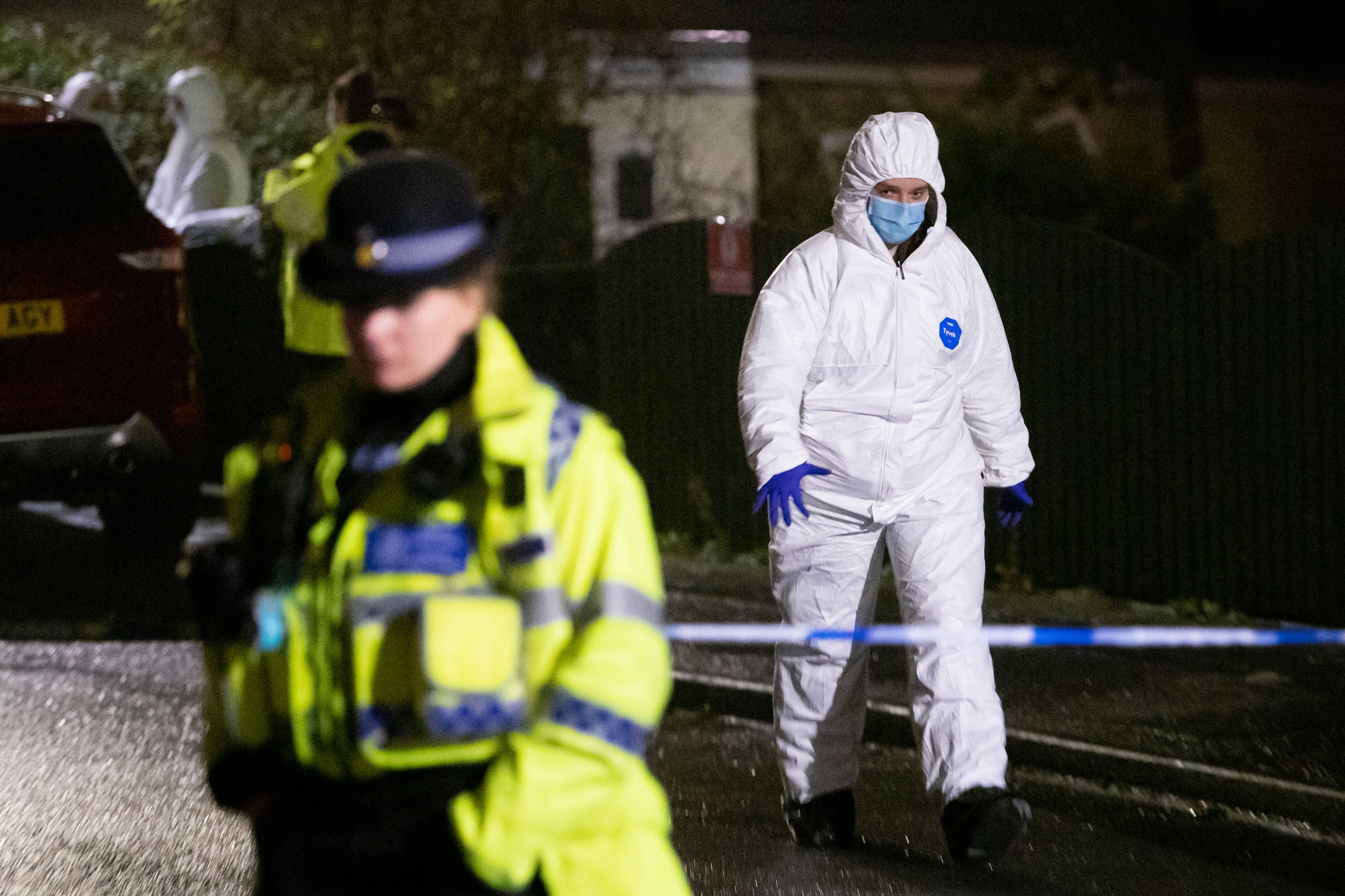 Police and forensic officers at the scene of the attack