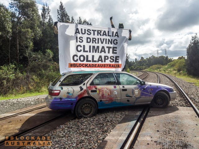 <p>The car is blocking a railway line heading into the world’s largest coal port</p>