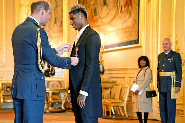 <p>Marcus Rashford is awarded his MBE by Prince William at Windsor Castle</p>