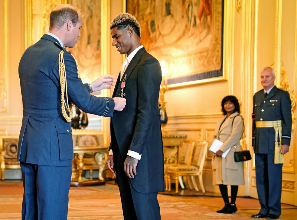 <p>Marcus Rashford is awarded his MBE by Prince William at Windsor Castle</p>