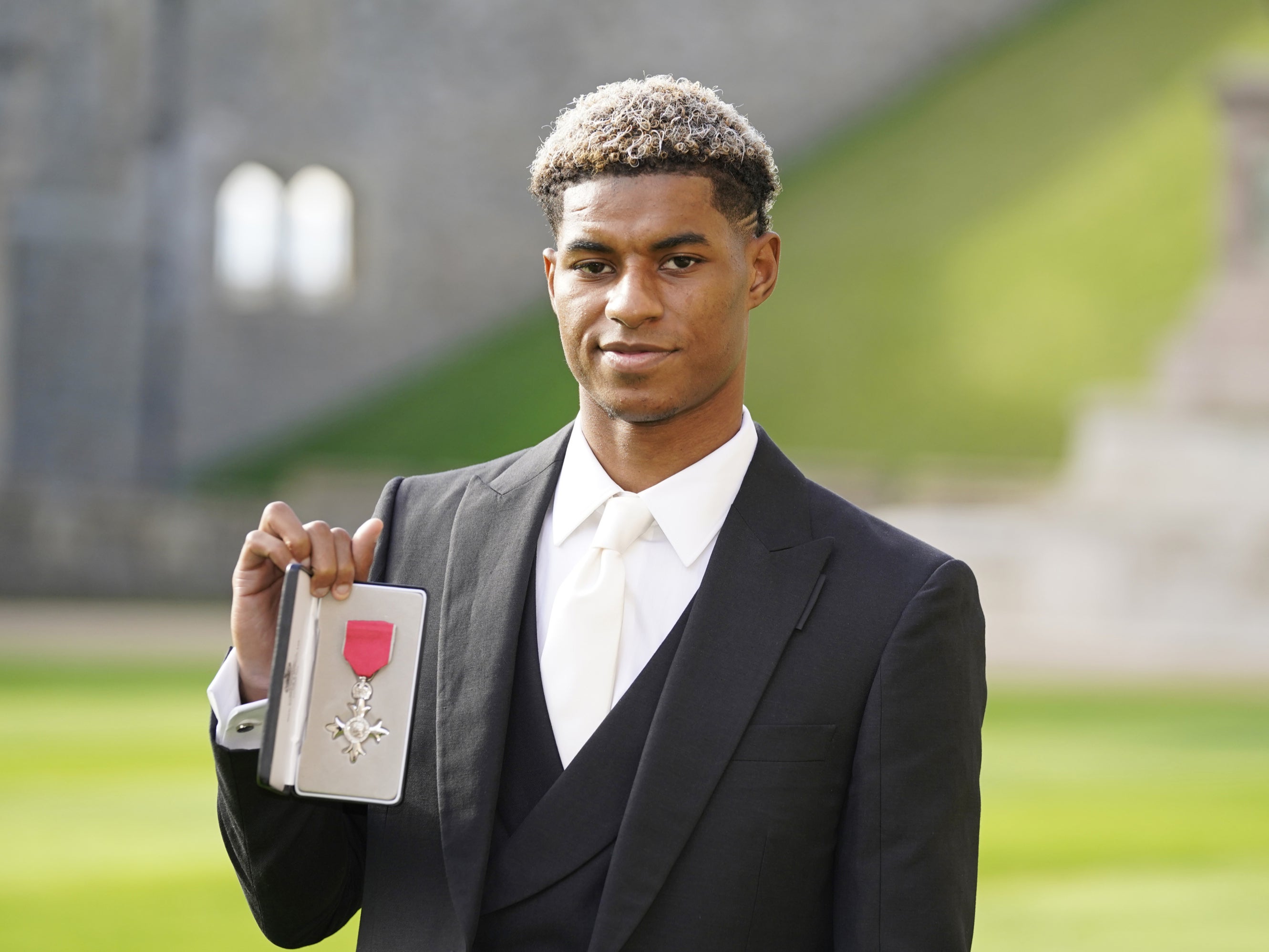 Mr Rashford had to wait a year to collect his MBE because of the Covid pandemic