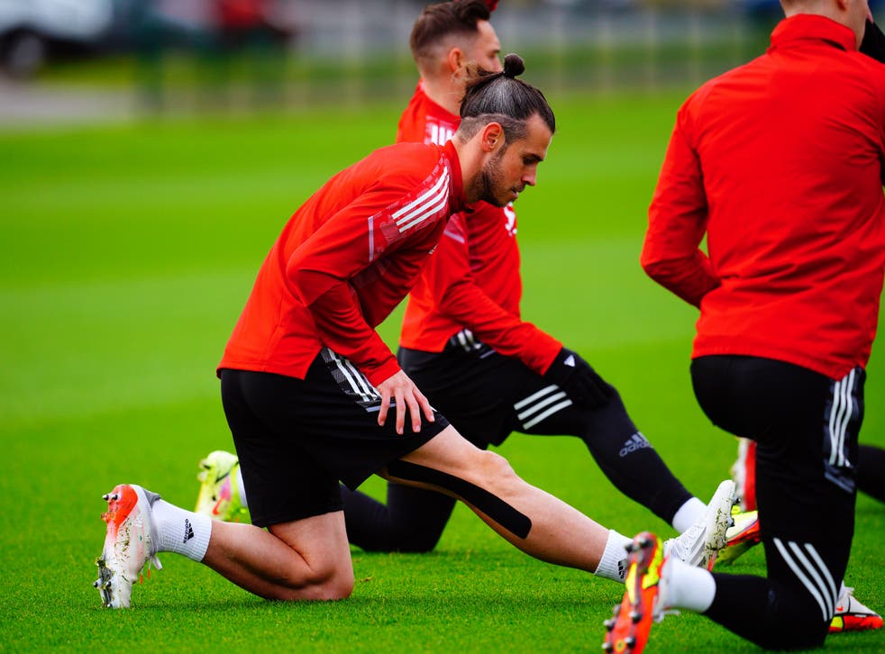 <p>Wales captain Gareth Bale stretching during a squad training session (Ben Birchall/PA)</p>