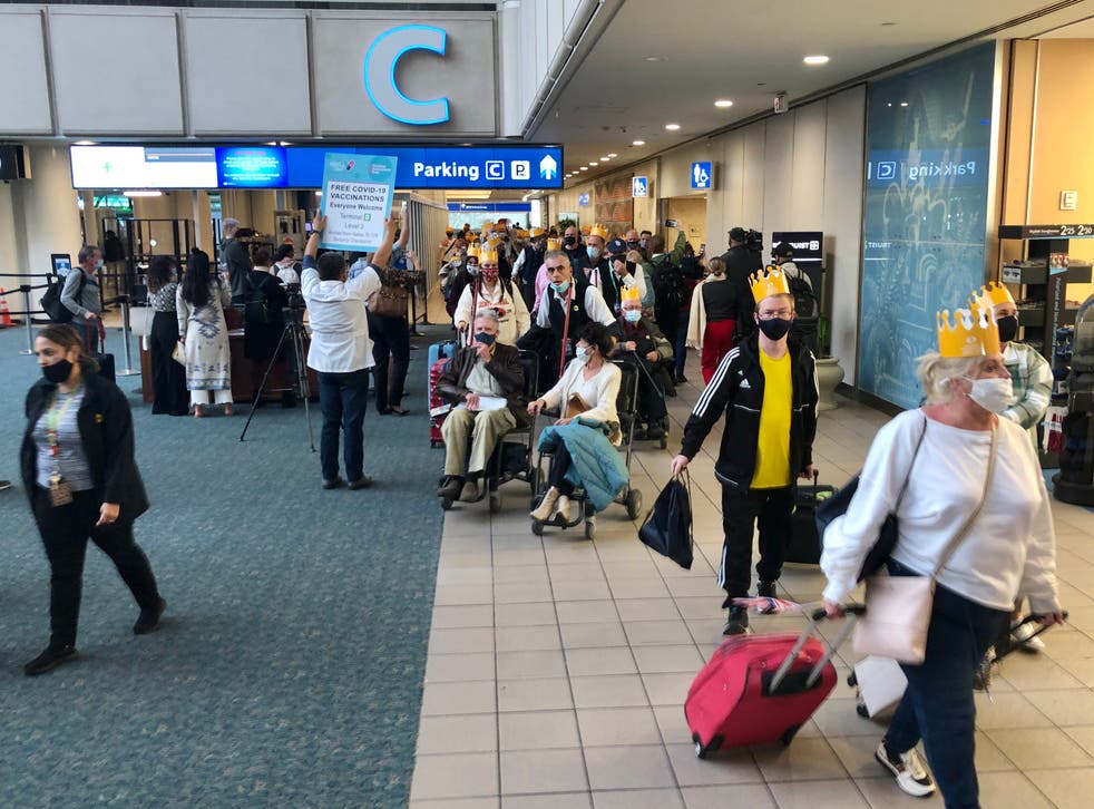 <p>Back in the USA: Passengers at Orlando airport in Florida arriving on the first flight from the UK – Virgin Atlantic from Manchester</p>