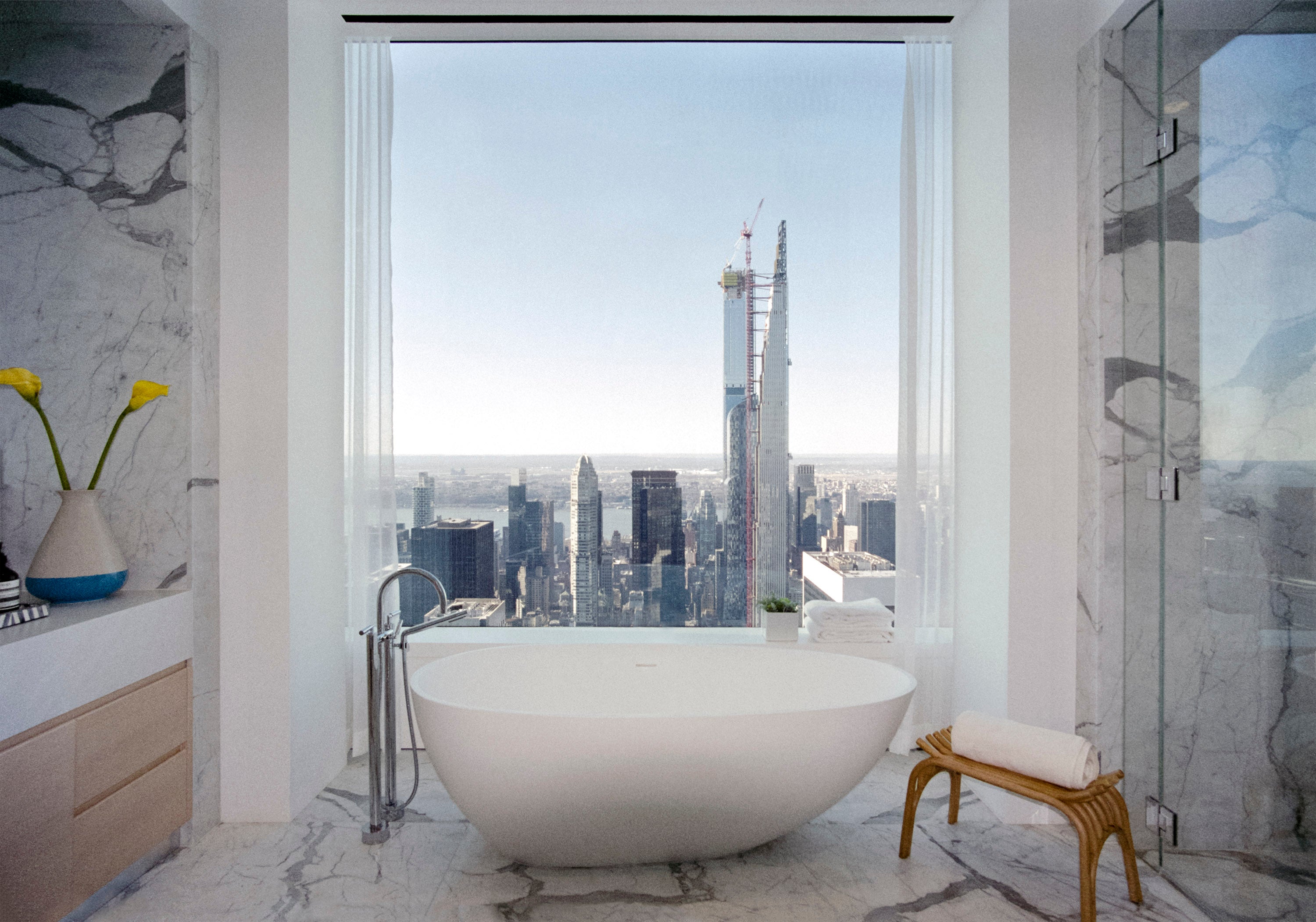 Western view from ‘her’ bathroom from one of the upper floor staged apartments at Rafael Viñoly’s 432 Park Avenue.