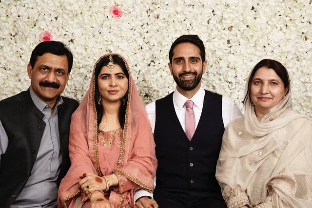 <p>Malala with her new husband, Asser, and her parents </p>
