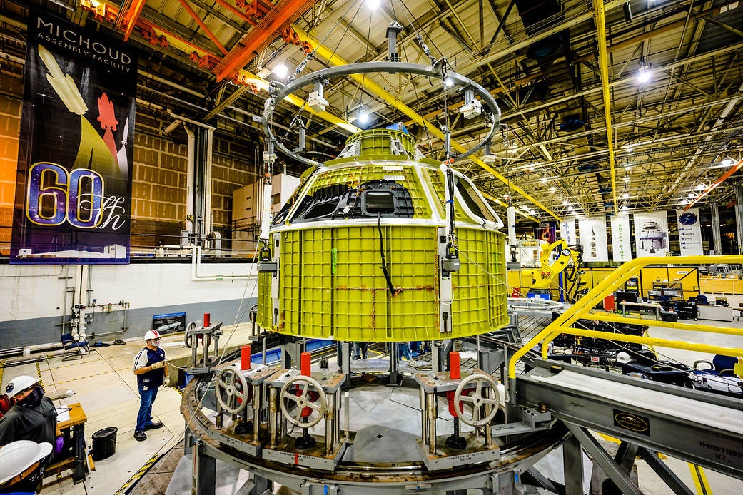 Orion’s newly completed pressure vessel for the Artemis III mission is lifted out of the welding tool at Nasa’s Michoud Assembly Facility in New Orleans