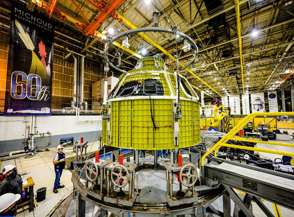 <p>Orion’s newly completed pressure vessel for the Artemis III mission is lifted out of the welding tool at Nasa’s Michoud Assembly Facility in New Orleans</p>