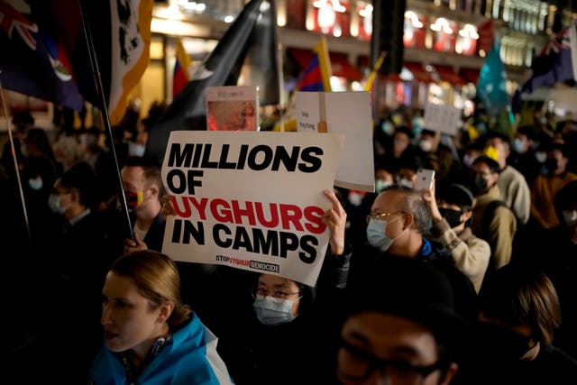 <p>Demonstrators supporting Tibetans, Uyghurs and Hong Kongers take part in a protest against the Chinese Communist Party on 72nd National Day of the People’s Republic of China</p>