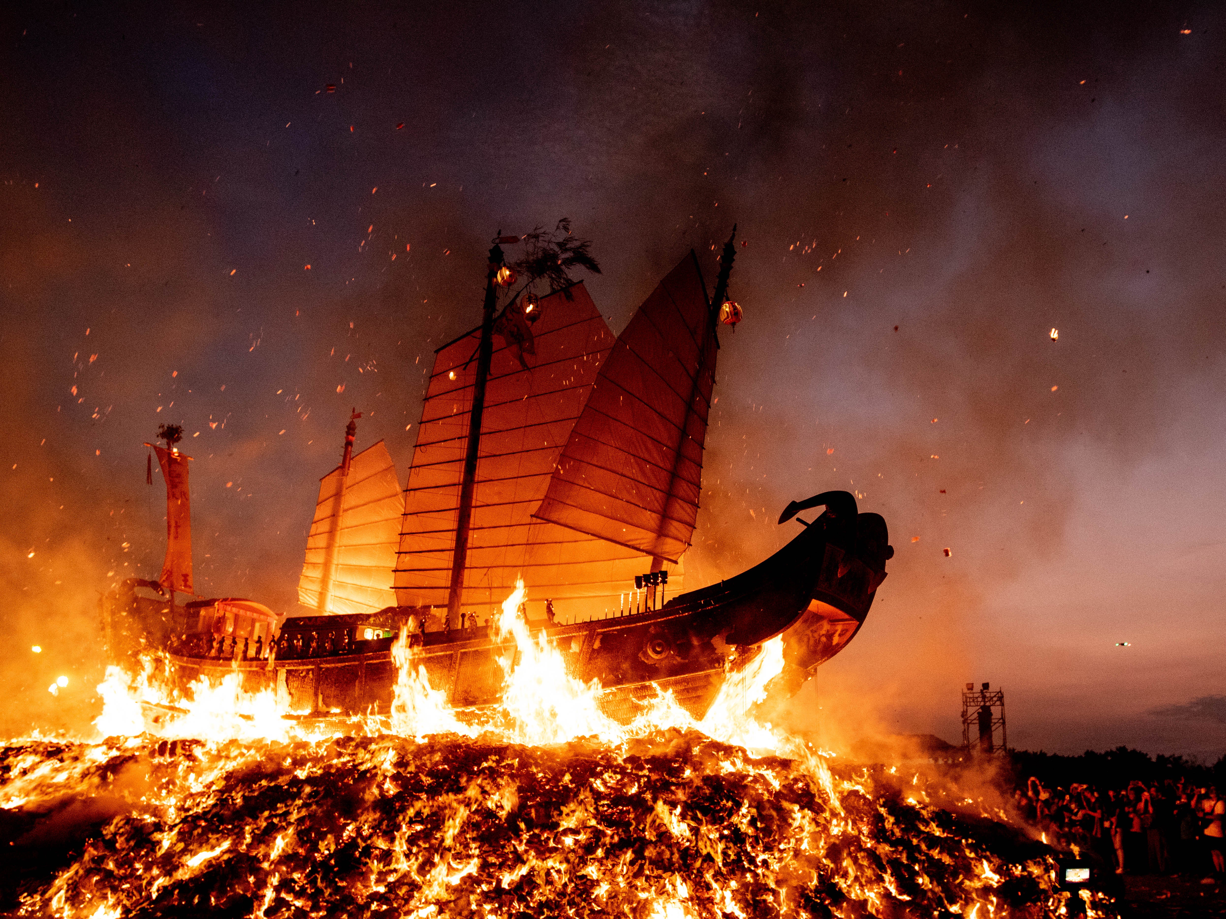 The Wang Ye boat is engulfed in flames on a beach in Donggang, southern Taiwan