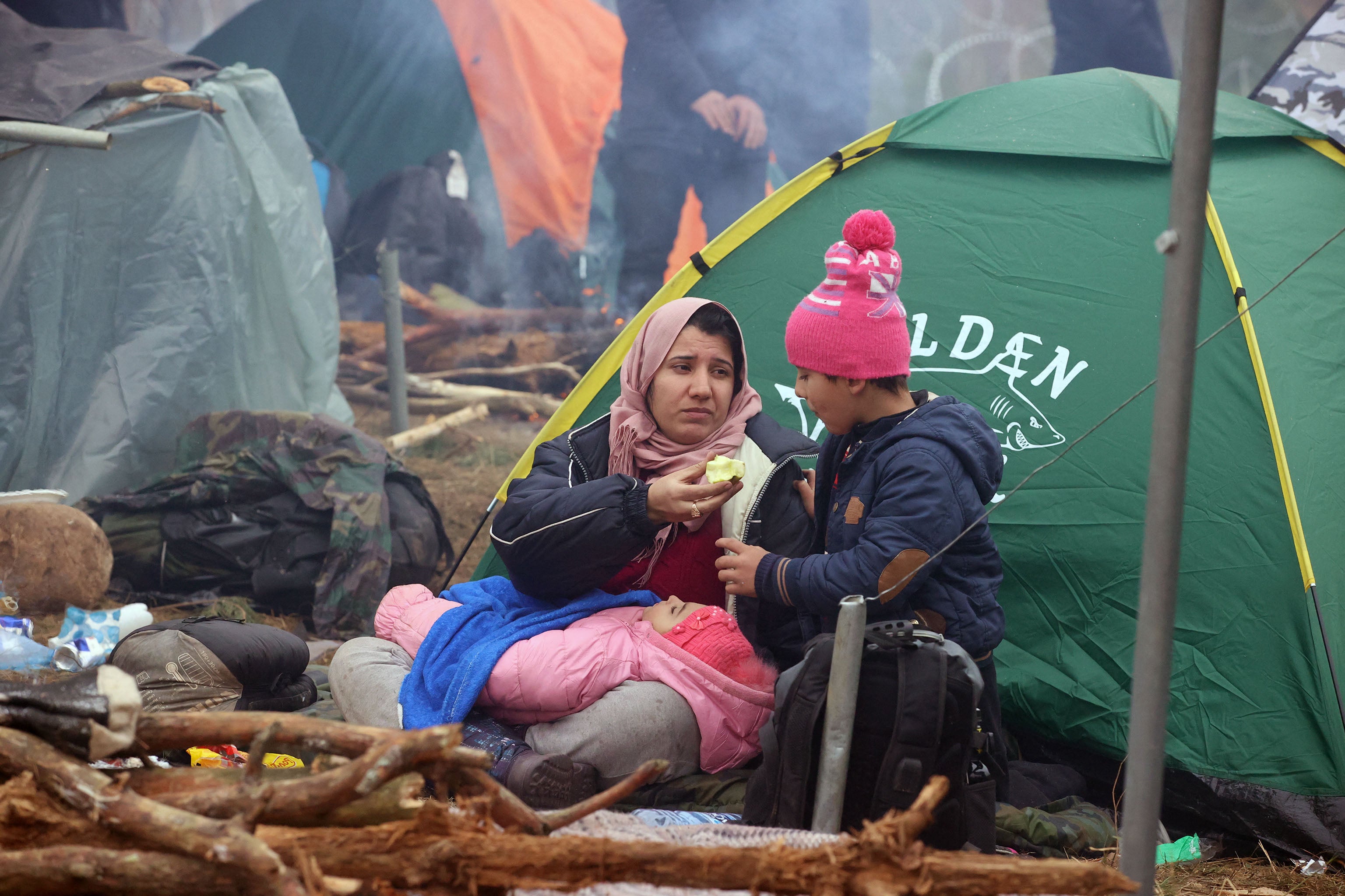 Migrants at a camp on the Belarusian-Polish border in the Grodno region