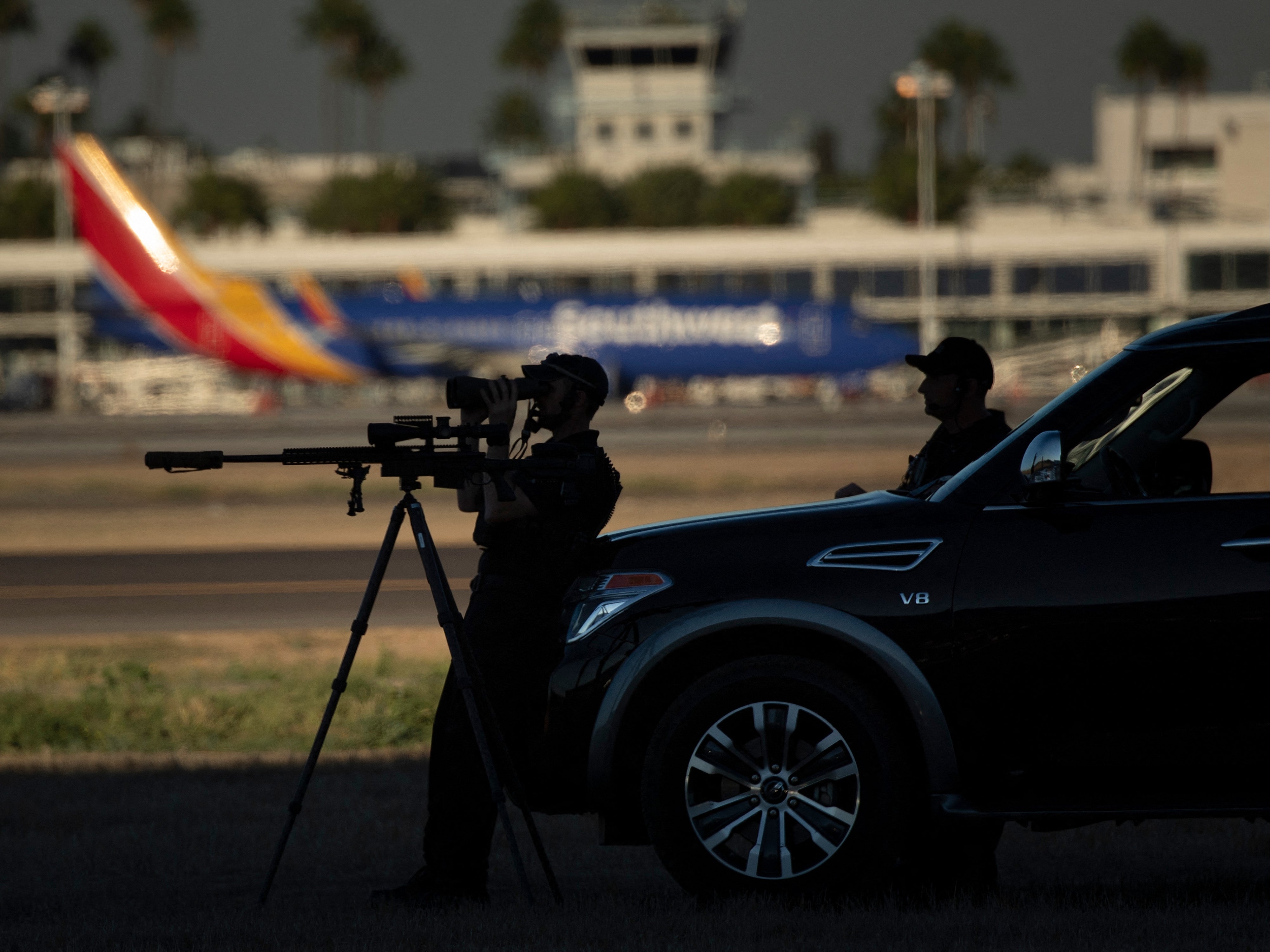 Snipers stand guard as US President Joe Biden arrives at Long Beach Airport in Long Beach, California on September 13, 2021