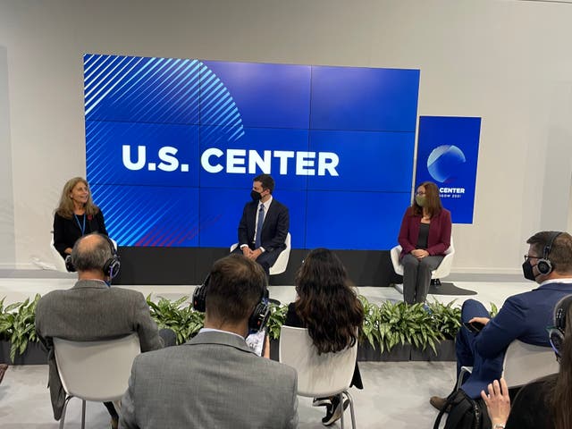 <p>US Transport Secretary Pete Buttigieg (center) and climate scientist Dr Katharine Hayhoe discuss decarbonizing transportation at Cop26 in Glasgow on Wednesday</p>