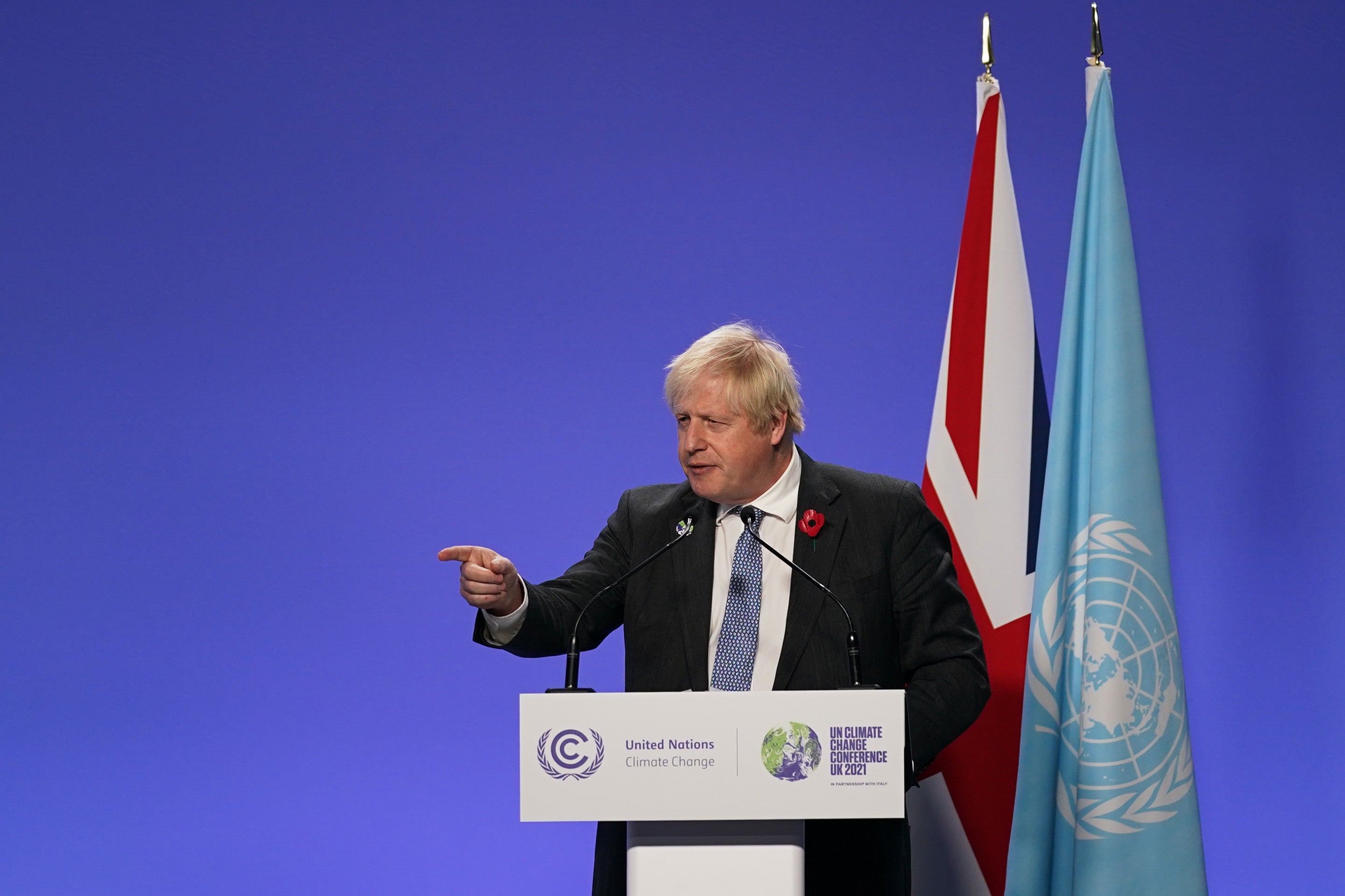 Boris Johnson takes journalists’ questions at a Cop26 press conference in Glasgow