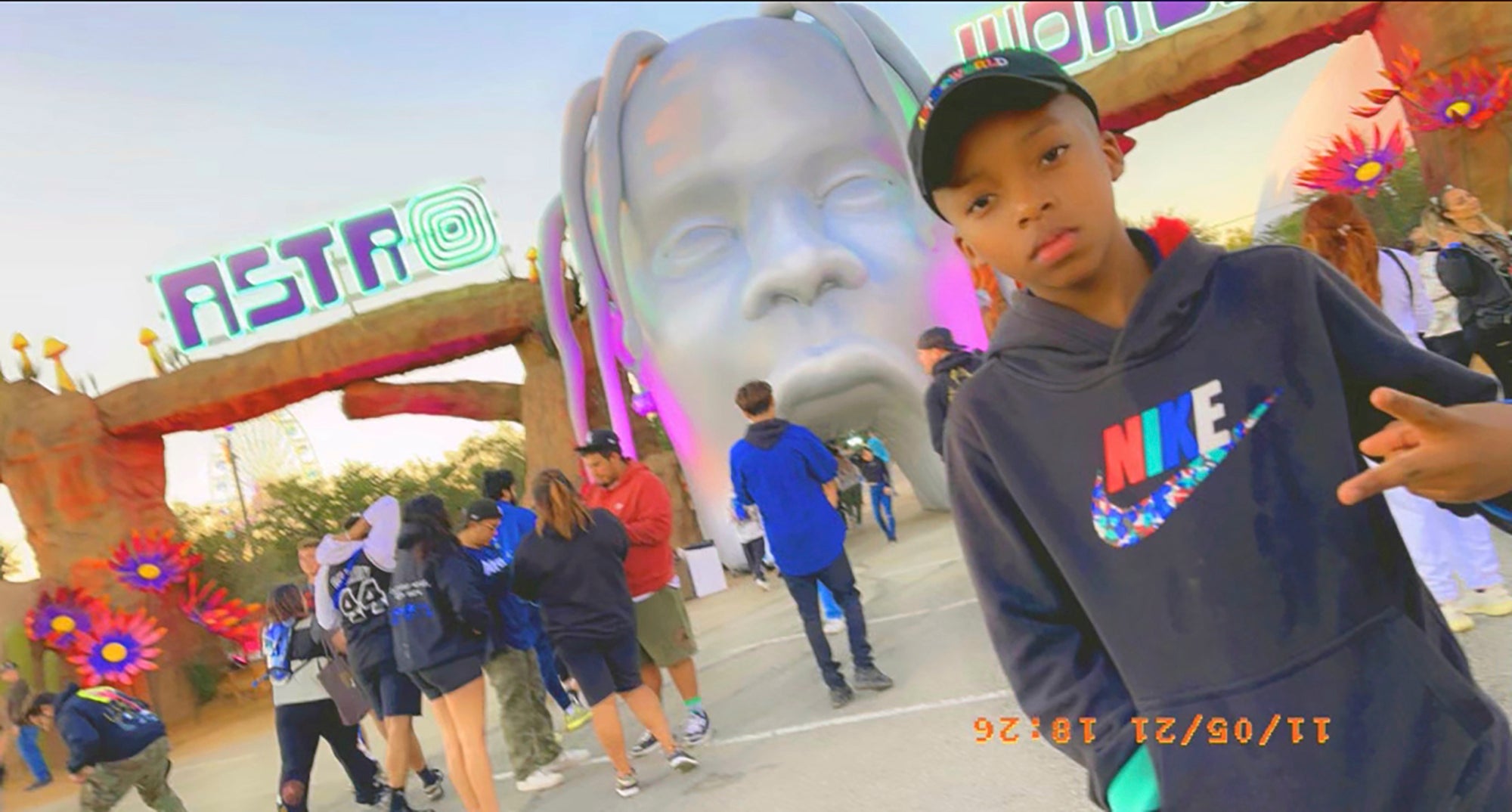 Nine-year-old Ezra Blount poses outside the Astroworld music festival in Houston