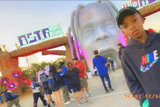 <p>Nine-year-old Ezra Blount poses outside the Astroworld music festival in Houston</p>